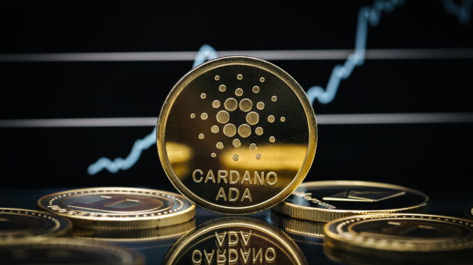 Cardano Ada cryptocurrency coin close-up, in front of a price chart