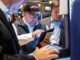 A trader wearing a Trump hat works on the floor of the New York Stock Exchange