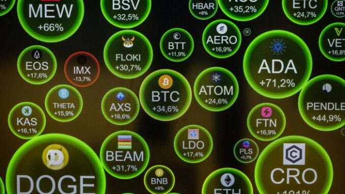 A screen shows cryptocurrency market movements at a cryptocurrency exchange in Barcelona, Spain