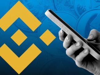 Composite image of Binance logo and hand holding mobile phone